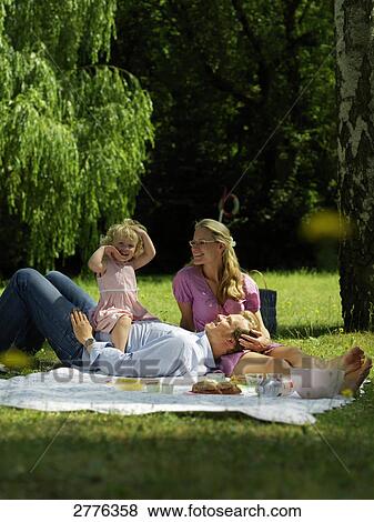 Family having picnic View Large Photo Image Stock Photo - Family having picnic . Fotosearch