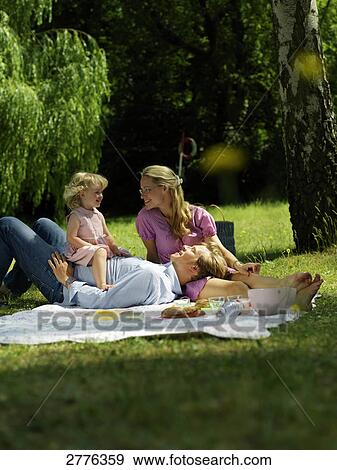 Family having picnic View Large Photo Image Stock Photo - Family having picnic . Fotosearch