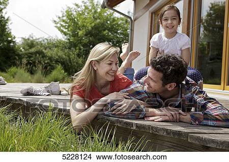 Family in front of Lehner energy house, Poing, Bavaria, Germany, Europe View Large Photo Image Picture - Family in front of Lehner energy house, Poing, Bavaria, Germany, Europe . Fotosearch