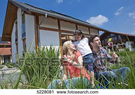 Family in front of Lehner energy house, Poing, Bavaria, Germany, Europe View Large Photo Image Stock Image - Family in front of Lehner energy house, Poing, Bavaria, Germany, Europe . Fotosearch