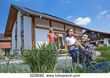 Family in front of Lehner energy house, Poing, Bavaria, Germany, Europe View Large Photo Image Stock Image - Family in front of Lehner energy house, Poing, Bavaria, Germany, Europe . Fotosearch