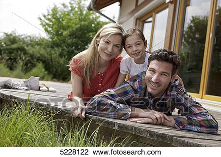 Family in front of Lehner energy house, Poing, Bavaria, Germany, Europe View Large Photo Image Stock Image - Family in front of Lehner energy house, Poing, Bavaria, Germany, Europe . Fotosearch