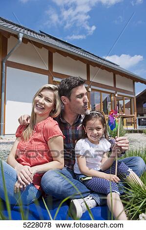 Family in front of Lehner energy house, Poing, Bavaria, Germany, Europe View Large Photo Image Stock Photo - Family in front of Lehner energy house, Poing, Bavaria, Germany, Europe . Fotosearch