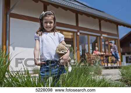 Family in front of Lehner energy house, Poing, Bavaria, Germany, Europe View Large Photo Image Stock Photo - Family in front of Lehner energy house, Poing, Bavaria, Germany, Europe . Fotosearch