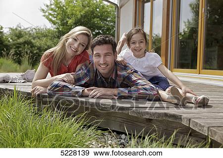 Family in front of Lehner energy house, Poing, Bavaria, Germany, Europe View Large Photo Image Stock Photo - Family in front of Lehner energy house, Poing, Bavaria, Germany, Europe . Fotosearch