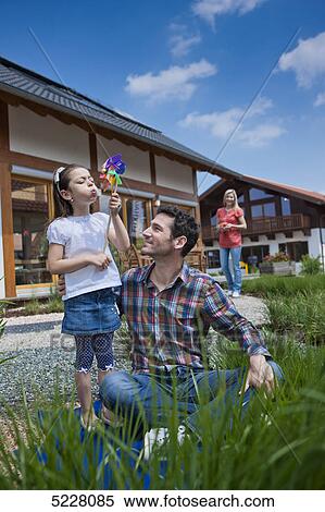 Family in front of Lehner energy house, Poing, Bavaria, Germany, Europe View Large Photo Image Stock Photography - Family in front of Lehner energy house, Poing, Bavaria, Germany, Europe . Fotosearch