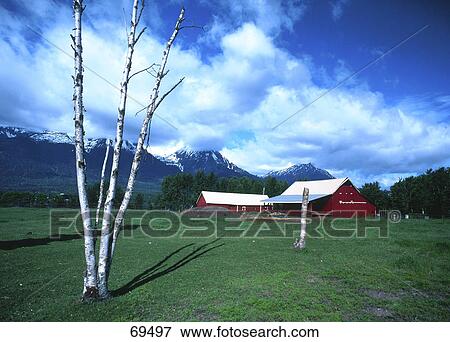 Stock Photo - Farmhouse near mountain, Smithers, British Columbia, Canada . Fotosearch