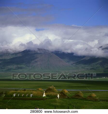 Stock Image - Farmhouses on rural landscape . Fotosearch