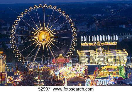 Ferris wheel lit up at night, Oktoberfest, Munich, Bavaria, Germany View Large Photo Image Stock Photo - Ferris wheel lit up at night, Oktoberfest, Munich, Bavaria, Germany . Fotosearch