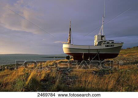 Picture - Fishing boat at coast, Varangerfjord, Norway . Fotosearch