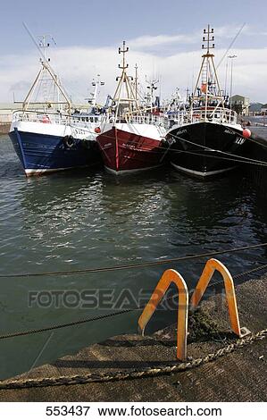 Fishing boats moored at harbor, Ireland, UK View Large Photo Image Stock Photo - Fishing boats moored at harbor, Ireland, UK . Fotosearch