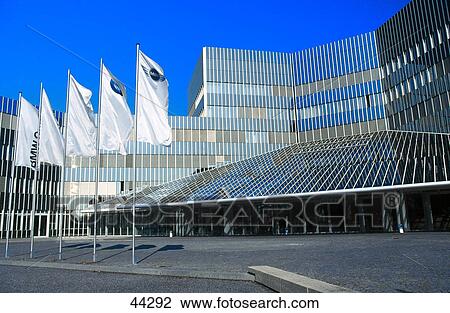 Stock Image - Flags in front of office building, BMW Research Center, Munich, Bavaria, Germany . Fotosearch