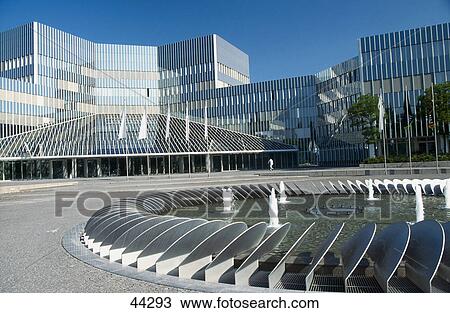 Stock Image - Fountain in front of office building, BMW Research Center, Munich, Bavaria, Germany . Fotosearch