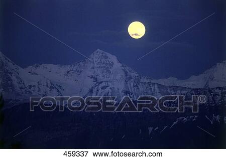 Full moon lit up over mountain range, Switzerland View Large Photo Image Stock Photo - Full moon lit up over mountain range, Switzerland . Fotosearch