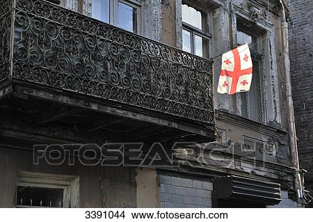 Georgian flag at the balcony of an old building, Tbilisi, Georgia, low angle view View Large Photo Image Picture - Georgian flag at the balcony of an old building, Tbilisi, Georgia, low angle view . Fotosearch
