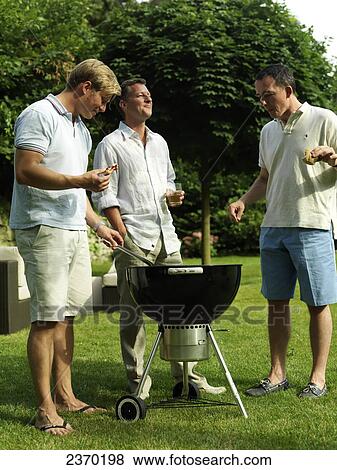 Stock Photo - Group of men having barbecue . Fotosearch