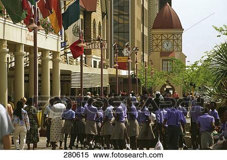 Stock Photography - Group of school children in front of clock tower, Namibia . Fotosearch