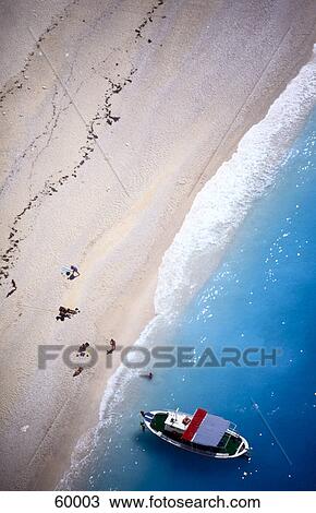 High angle view of motorboat and tourists on beach, Ionic Islands, Zakynthos, Greece View Large Photo Image Stock Image - High angle view of motorboat and tourists on beach, Ionic Islands, Zakynthos, Greece . Fotosearch