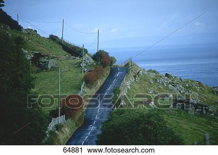 Stock Image - High angle view of mountain road, Cushendun, County Antrim, Republic Of Ireland . Fotosearch