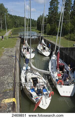 High angle view of people on sailboats in canal, Gota Canal, Sweden View Large Photo Image Stock Image - High angle view of people on sailboats in canal, Gota Canal, Sweden . Fotosearch