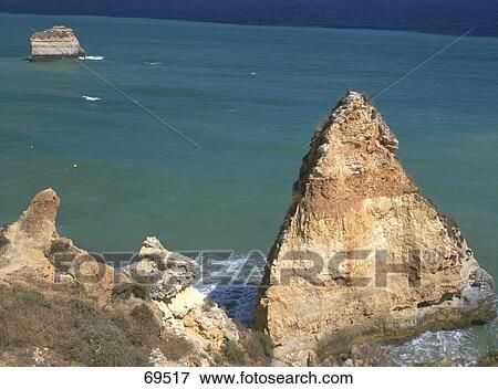 Stock Photo - High angle view of rock formations on coast, Praia Da Marinha, Carvoeiro, Lagoa, Algarve, Portugal . Fotosearch