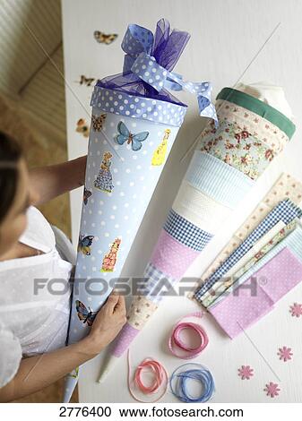 High angle view of woman holding cardboard cone View Large Photo Image Stock Image - High angle view of woman holding cardboard cone . Fotosearch