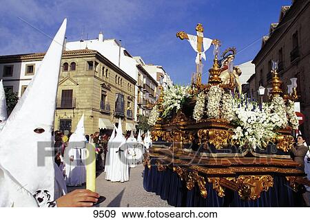 Hooded penitents around chariot in holy week procession, Andalusia, Spain View Large Photo Image Stock Photo - Hooded penitents around chariot in holy week procession, Andalusia, Spain . Fotosearch