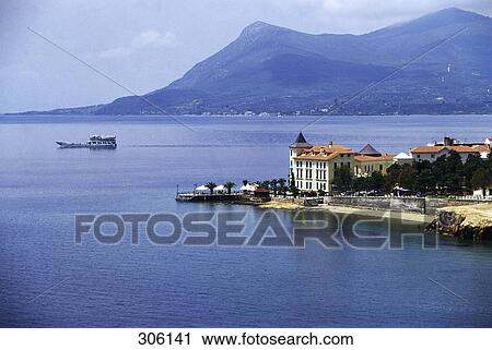 Stock Image - Hotel at waterfront, Monemvasia, Peloponnese, Greece . Fotosearch