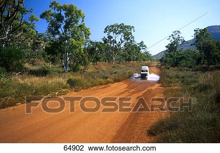 Stock Image - Jeep crossing water on road, Gibb River Road, Kimberley, Australia . Fotosearch