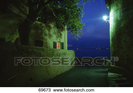 Lantern lit up on wall of citadel, Calvi, Corsica, France View Large Photo Image Stock Image - Lantern lit up on wall of citadel, Calvi, Corsica, France . Fotosearch