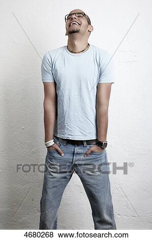 Stock Photo - Laughing young man with glasses . Fotosearch