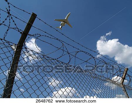 Stock Image - Low angle view of airplane in flight, Tempelhof International Airport, Tempelhof-Schoeneberg, Berlin, Germany . Fotosearch