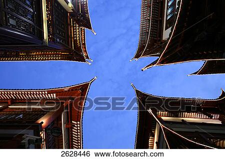 Low angle view of buildings lit up at dusk, Yuyuan Garden Bazaar, Shanghai, China View Large Photo Image Stock Photograph - Low angle view of buildings lit up at dusk, Yuyuan Garden Bazaar, Shanghai, China . Fotosearch