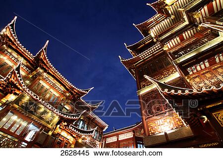Low angle view of buildings lit up at night, Yuyuan Garden Bazaar, Shanghai, China View Large Photo Image Stock Photography - Low angle view of buildings lit up at night, Yuyuan Garden Bazaar, Shanghai, China . Fotosearch
