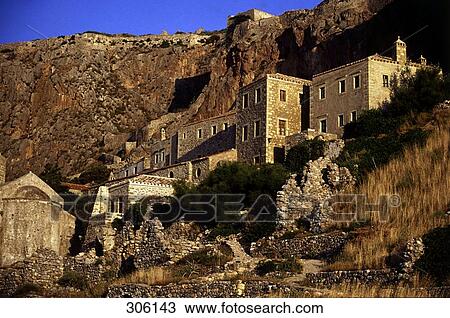 Stock Image - Low angle view of buildings on hill, Monemvasia, Peloponnese, Greece . Fotosearch