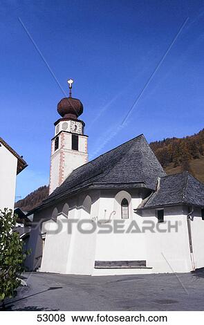 Low angle view of church in street, Vinschgau, Alto Adige, Italy View Large Photo Image Stock Photo - Low angle view of church in street, Vinschgau, Alto Adige, Italy . Fotosearch