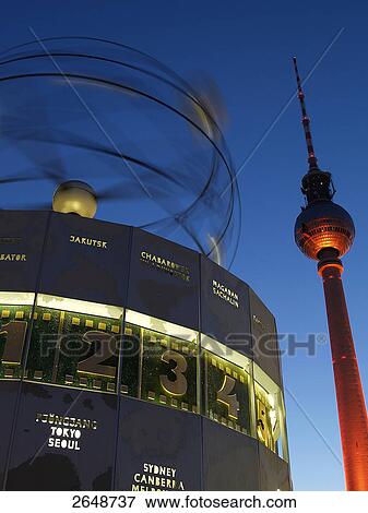 Stock Photo - Low angle view of clock and communication tower, Urania World Clock, Fernsehturm, Berlin, Germany . Fotosearch