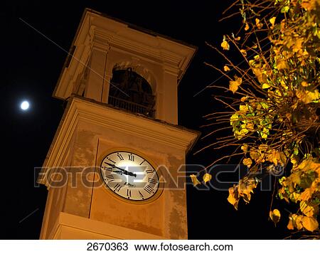 Low angle view of clock tower, Piedmont, Italy View Large Photo Image Stock Image - Low angle view of clock tower, Piedmont, Italy . Fotosearch