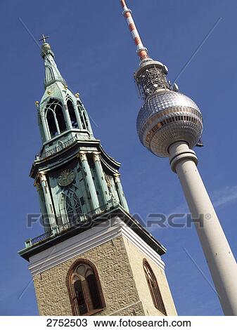 Low angle view of communication tower with church spire View Large Photo Image Stock Image - Low angle view of communication tower with church spire . Fotosearch