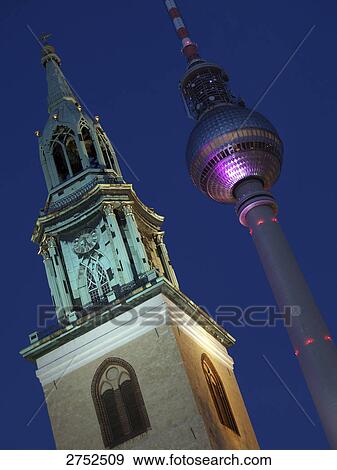 Low angle view of communication tower and church spire View Large Photo Image Stock Photo - Low angle view of communication tower and church spire . Fotosearch