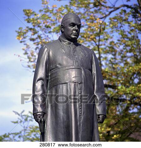 Stock Photo - Low angle view of Father Sebastian Kneipp sculpture, Germany . Fotosearch