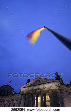 Picture - Low angle view of flag in front of building, Germany . Fotosearch