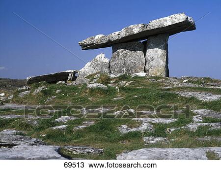 Stock Image - Low angle view of portal tomb, Poulnabrone dolmen, The Burren, County Clare, Republic Of Ireland . Fotosearch