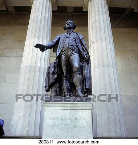 Stock Image - Low angle view of sculpture in front of building . Fotosearch