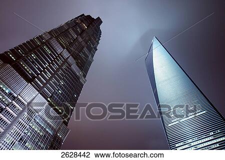 Low angle view of skyscrapers lit up at night, Shanghai World Financial Center, Jin Mao Tower, Pudong, Shanghai, China View Large Photo Image Stock Image - Low angle view of skyscrapers lit up at night, Shanghai World Financial Center, Jin Mao Tower, Pudong, Shanghai, China . Fotosearch