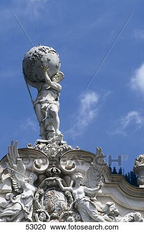 Stock Image - Low angle view of statue of Atlas, Linderhof Palace, Oberammergau, Oberbayern, Bavaria, Germany . Fotosearch