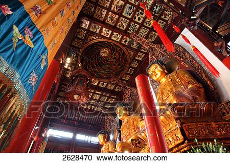 Stock Image - Low angle view of statues of buddha in temple, Jade Buddha Temple, Shanghai, China . Fotosearch