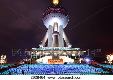 Low angle view of tv tower lit up at night, Oriental Pearl Tower, Pudong, Shanghai, China View Large Photo Image Picture - Low angle view of tv tower lit up at night, Oriental Pearl Tower, Pudong, Shanghai, China . Fotosearch