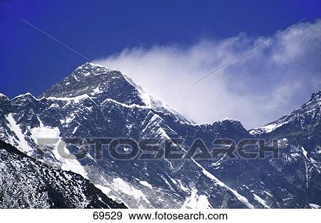 Majestic mountain range against blue sky, Mt Everest, Nepal View Large Photo Image Stock Photo - Majestic mountain range against blue sky, Mt Everest, Nepal . Fotosearch