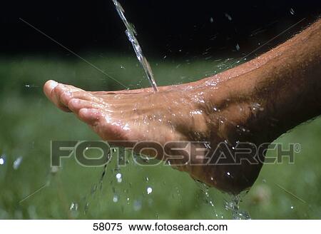 Man washing his foot View Large Photo Image Stock Photography - Man washing his foot . Fotosearch
